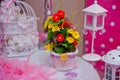 Flower arrangements . Cage with flowers stand in restaurant .White roses put on the top of bird cage . Bouquet of yellow and Royalty Free Stock Photo