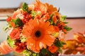 Flower autumn colors with red berries of viburnum,orange gerbera,berries of eucalyptus,orange Ornithogalum,orange bouquet roses of