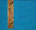Flower bamboo banner on blue ribbed wood