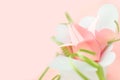 Flower banner. Close up composition of pink Origami paper tulip with green decorations in white box-heart on pink background Royalty Free Stock Photo