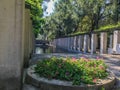 Flower beds and modern columned arcade in the Parc de Bercy, Paris, France