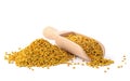 Flower bee pollen and a wooden slove is isolated on a white background. Natural remedy for immunity enhancement