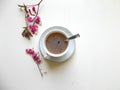 Tea in a white Cup, with pink flowers Royalty Free Stock Photo