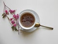 Tea in a white Cup, with pink flowers Royalty Free Stock Photo