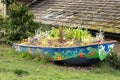 Flower boat blooms alongside canal