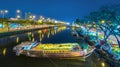 Flower boats full of flowers parked along canal wharf in sunset Royalty Free Stock Photo