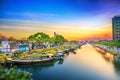 Flower boats full of flowers parked along canal wharf in sunset Royalty Free Stock Photo