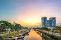 Flower boats full of flowers parked along canal wharf in sunset Royalty Free Stock Photo