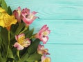 Flower bouquet alstroemeria blooming arrangement beauty decorative on a wooden background, frame Royalty Free Stock Photo