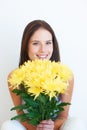 Flower bouquet, face portrait and happy woman with floral studio product, sustainable gift or yellow present. Nature Royalty Free Stock Photo