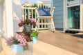 Flower bouquet on a floor with rocking chair background in a balcony Royalty Free Stock Photo