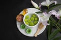 Flower bowl and water.Spa treatment setting