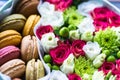 Flower box with flowers and macarons composition closeup Royalty Free Stock Photo