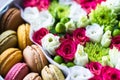 Flower box with flowers and macarons composition closeup Royalty Free Stock Photo