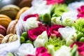 Flower box with flowers and macarons composition closeup Royalty Free Stock Photo
