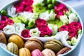 Flower box with flowers and macarons composition closeup Royalty Free Stock Photo