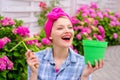 Flower care and watering. soils and fertilizers. Greenhouse flowers. happy woman gardener with flowers. hydrangea