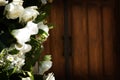 Flower with the church doors before a wedding