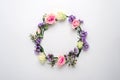 Flower circle, frame on white background, composition of roses, limonium, eustoma with copy space, flat lay, top view