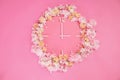 Flower clock on a pink scene Royalty Free Stock Photo