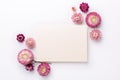 Flower composition. Blank of paper and frame made of dry flowers on white background. Flat lay. Top view. Copy space Royalty Free Stock Photo