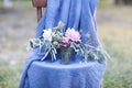 Flower composition on the chair decorated with texstile Royalty Free Stock Photo