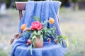 Flower composition on the chair decorated with texstile Royalty Free Stock Photo