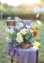 Flower composition on the chair decorated with texstile