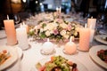 Flower composition decorating a served table for a celebration dinner Royalty Free Stock Photo