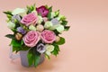 Beautiful bouquet of colorful flowers on a pinkk background close