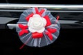 Flower decoration on a car door handle in dark color Royalty Free Stock Photo