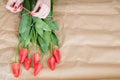 Flower delivery florist arrange red tulip bouquet