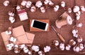Flower design with fluffy dried cotton bolls gift boxes, white smartphone and jute rope hank over rough brown burlap Top