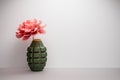 The flower in the disassembled hand grenade - anti-war concept