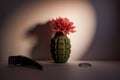 The flower in the disassembled hand grenade - anti-war concept