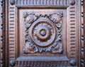Flower engraved on the wooden portal of an ancient church.