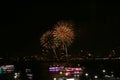 flower fireworks on beach and reflection color on water surface of light of city Royalty Free Stock Photo