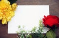 Flower frame with white Blank Paper on Wood Background. Flat Lay Top View Royalty Free Stock Photo