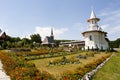 Flower garden and old traditional monastery