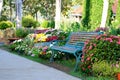 Flower garden and vintage bench Royalty Free Stock Photo