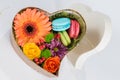 Flower gerbera and macaroon in heart shaped box Royalty Free Stock Photo