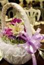 Flower girl basket with purple ribbon Royalty Free Stock Photo