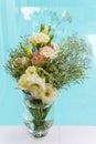 Flower glass vase and bouquet of pink and yellow flower with blu Royalty Free Stock Photo