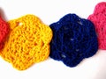Flower is knitted yellow, blue, pink,