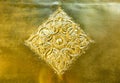 Flower and leaf pattern in Thai Lanna style carved on gold metal plate background decorate on golden pagoda in Buddhist temple