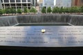 Flower left at the National 9/11 Memorial at Ground Zero in Lower Manhattan Royalty Free Stock Photo