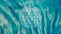 Flower of life sacred geometry symbol on turquoise blue ocean waters background or HD wallpaper