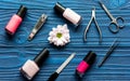 Flower, nail polish and manicure set on dark wooden background Royalty Free Stock Photo