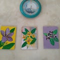 3 flower painting and wall clock