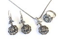 flower-patterned necklace and earrings with silver crystals